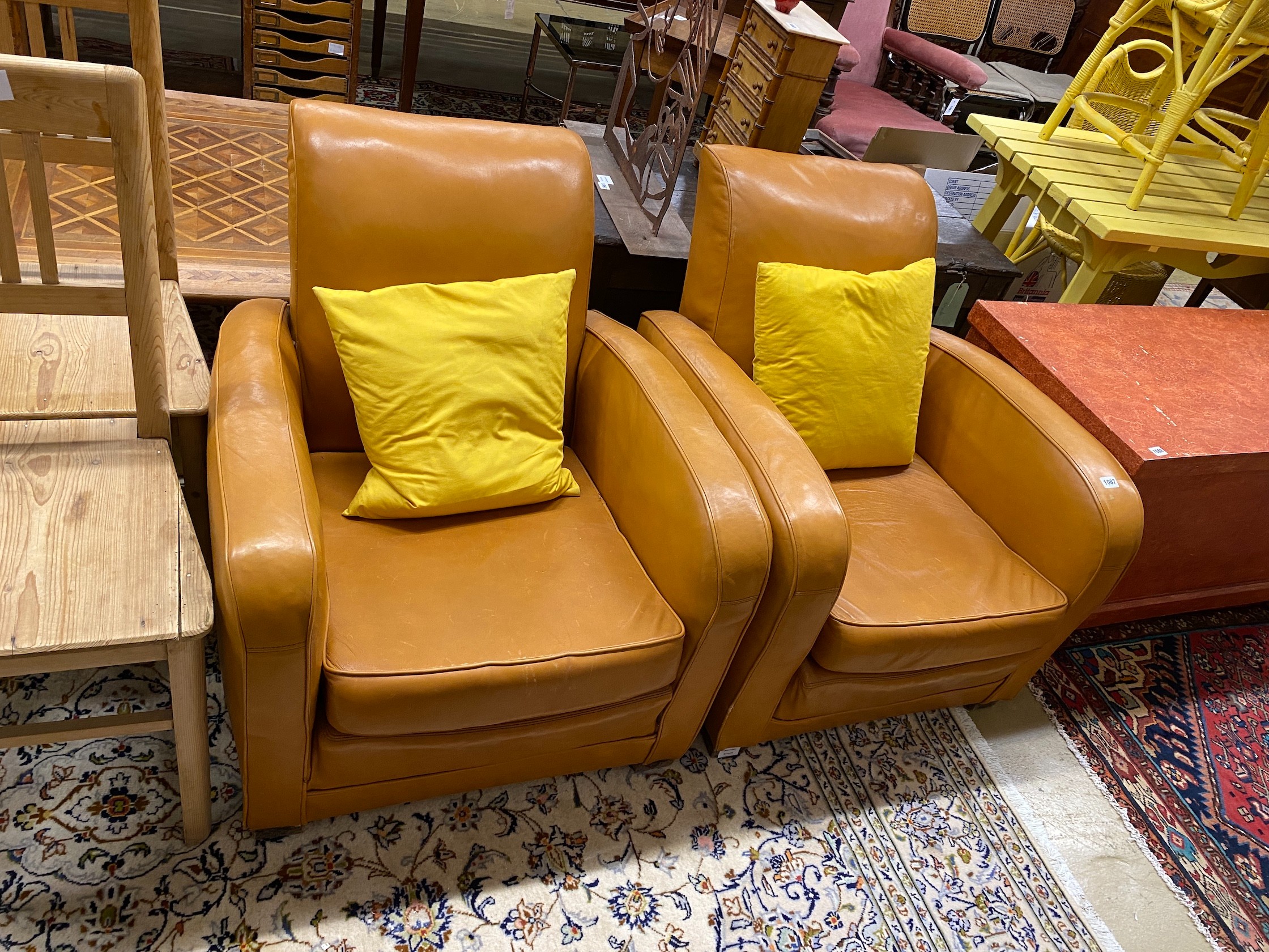 A pair of Art Deco style tan leather club armchairs, width 76cm, depth 80cm, height 78cm